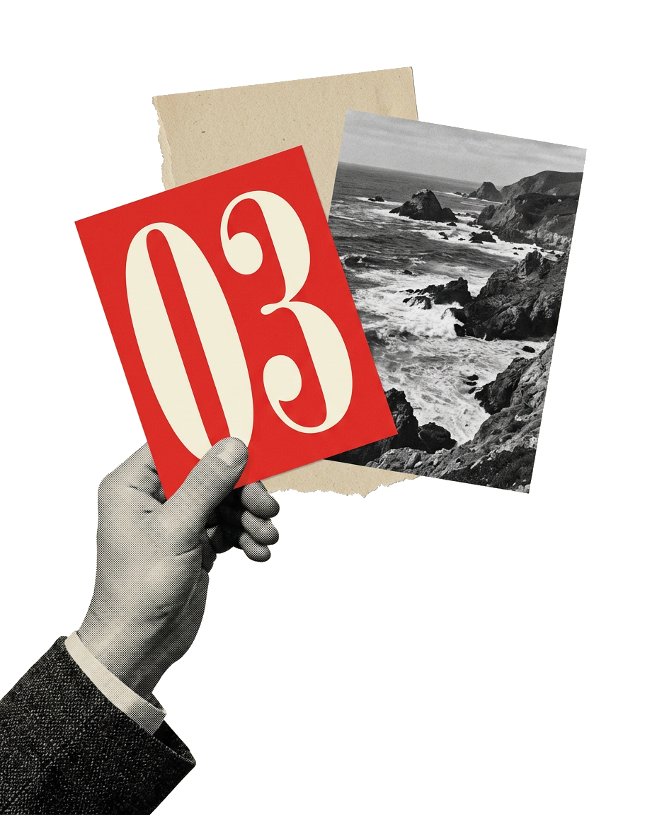 A hand holding up a red card printed with the number 03 in front of torn paper and a rocky coastline photograph